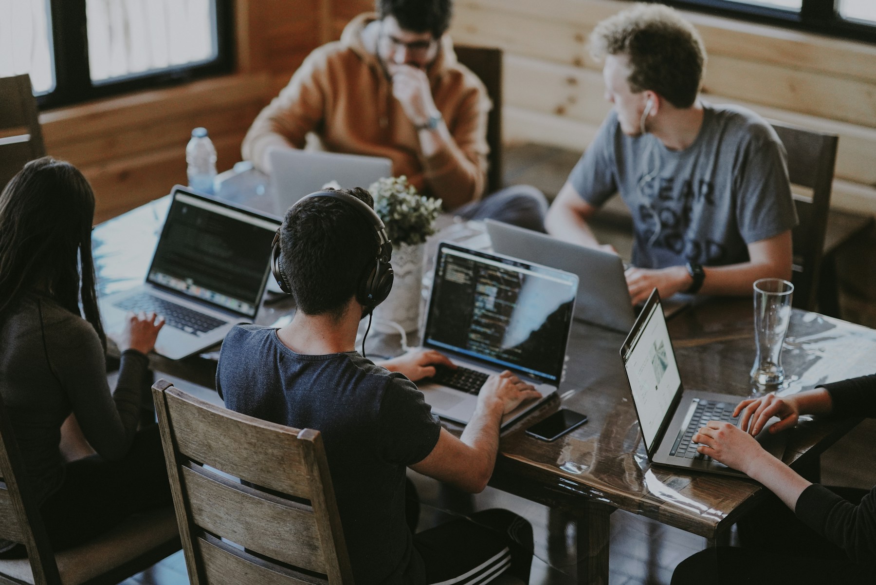 A digital product team collaborating in a bright office